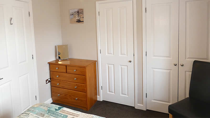 Fitted cupboards in double bedroom