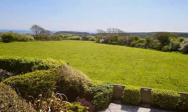 Views over countryside to the sea from Menagwins Court